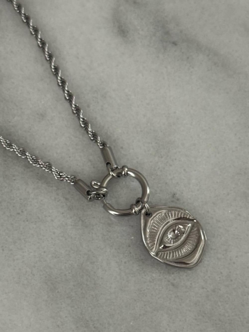 Silver Irregular Evil Eye Pendant Necklace 

Brand New

Stainless Steel